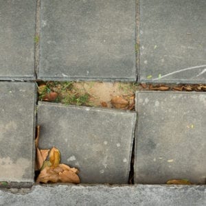 clogged gutters sidewalk damage